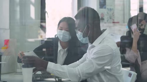 Modern International Office, Working in an Open Space, Office Workers and Managers in Medical Masks