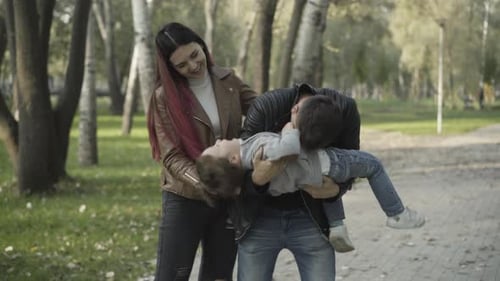 Loving Family Playing Together in the Park