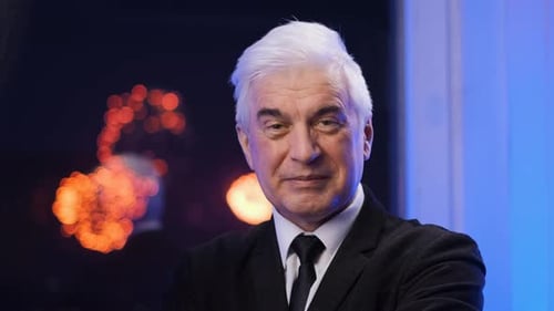 Mature Man in Suit at Night