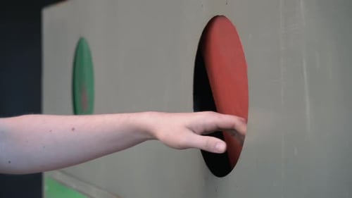 Hand Recycling Plastic Bottles in Container