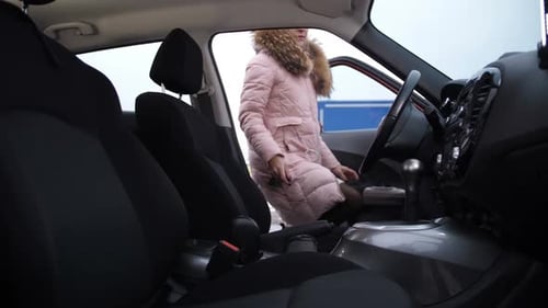 Woman Getting in the Car Ready to Drive