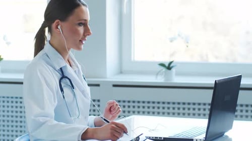 Professional medical doctors working in hospital office making research.
