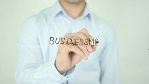 Hand Writes Businessman on Clear Surface