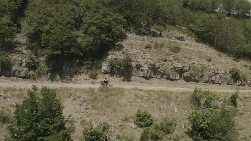 Aerial view of biker on road, Tuscany, Italy