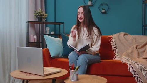 Woman Video Calling on Laptop from Home