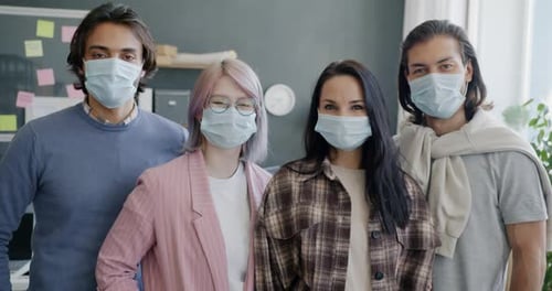 Diverse Group of People Coworkers Standing in Office Wearing Medical Masks