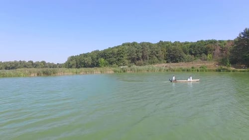 Two People in Boat on Lake, Aerial View