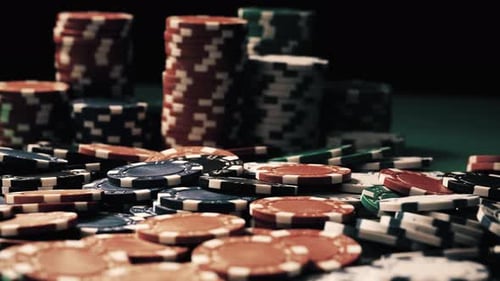 Vintage Close-up of Poker Chips Which Are at Stake Lying on a Green Table