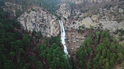 Beautiful Aerial Waterfall with Rocks in a Mountain