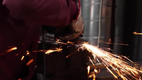 Metal Worker Using Power Tool Creating Bright Sparks