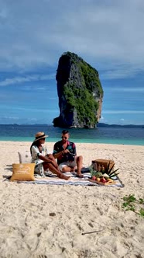 Koh Poda Krabi Thailand Asian Woman and European Men Having a Picnic on the Tropical Beach of Koh