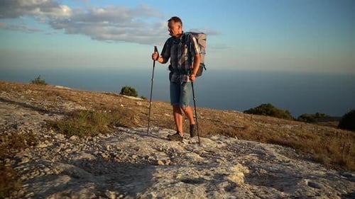 Young Male Hiker Climbing Mountain Against Backdrop of Amazing Natural Landscape Spbd