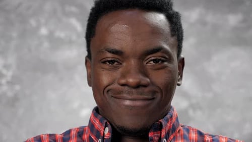 Close Up Smiling Happy Face Adult African American Man Looking at the Camera