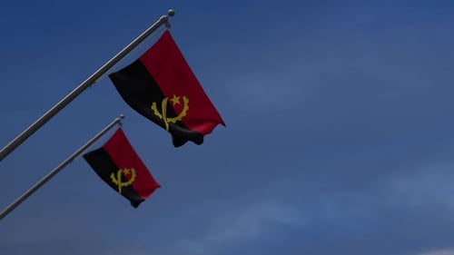 Realistic Angola Flag Waving in Blue Sky