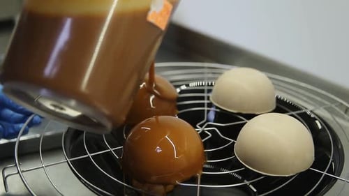 Pouring Caramel Sauce over Delicate Desserts