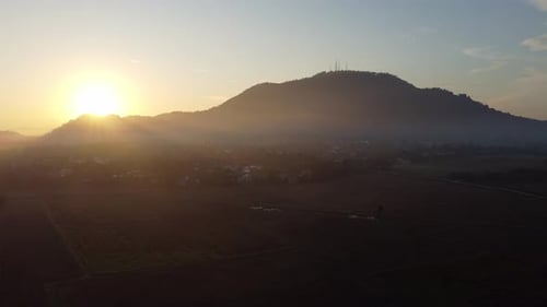 Drone view beautiful sunrise morning over dry paddy field