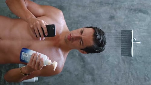 Young Adult Using Phone in Shower