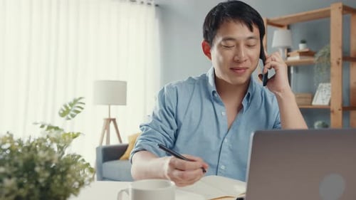 Young Adult Working From Home on Phone