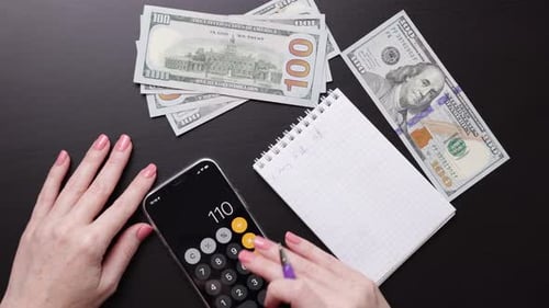 Calculating Finances with Calculator and US Currency