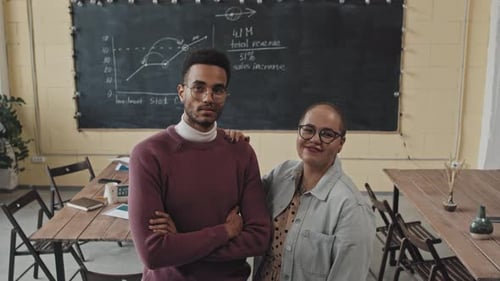 Teachers Posing in Modern Classroom