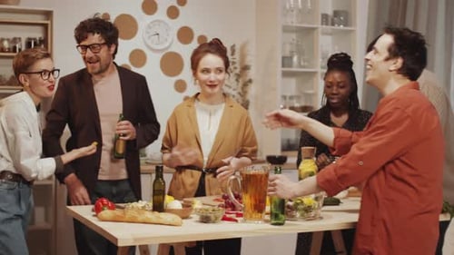 Young Adults Enjoying a Friendly Kitchen Gathering