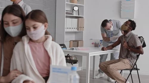 African Man Vaccinated in Busy Hospital