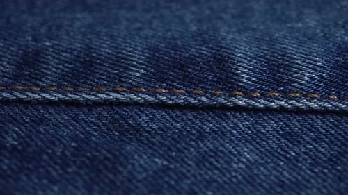 Blue Denim Fabric Close Up with Stitching