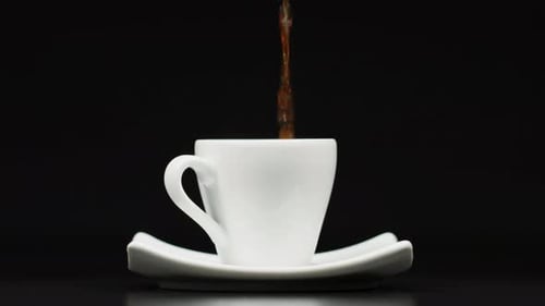 Coffee Pouring into a White Cup Close Up