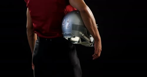 Football Player with Helmet on Black Background