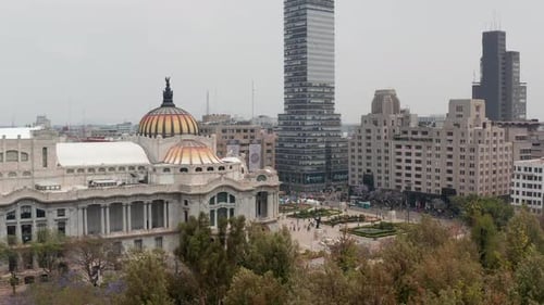 Reveal of City Ascending Drone Flying Around Colourful Dome with Bird Sculpture of Palace of Fine