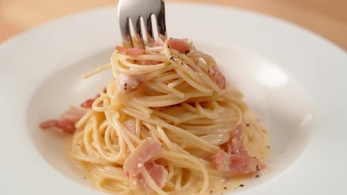 Delicious Spaghetti Carbonara with Bacon on Plate