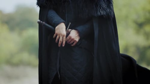 Close Up of a Warrior Taking His Sword Out of the Sheath,