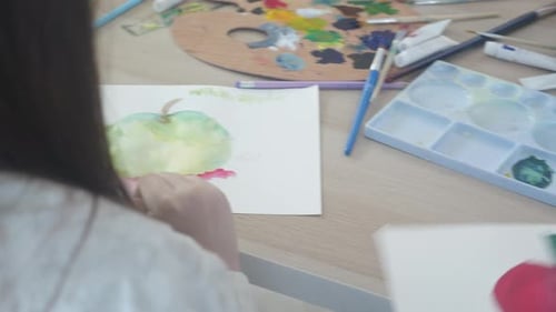 Children Painting Apples With Watercolors at Home
