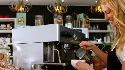 Waitress making cup of coffee