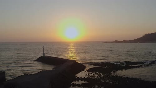 Coastal Waters at Golden Hour with Gentle Waves