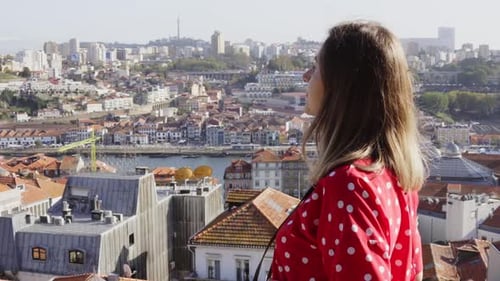 Young Woman Is Taking Photo of Panoramic View on Old City