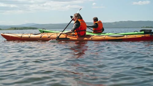 Couple Paddling in Lake
