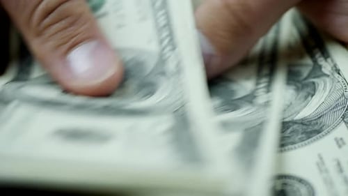 Counting Stack of US Hundred Dollar Bills