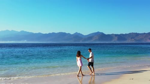 Happy Boy and Girl on Romantic Honeymoon Enjoy Luxury on Beach on Sunny White Sandy Background