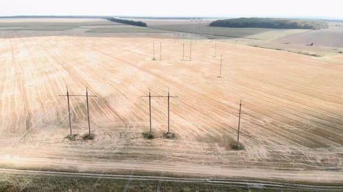 Aerial View of Open Field with Power Lines