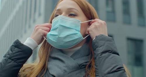 Woman on Street Wearing Face Protection in Prevention for Coronavirus Covid 19. Lady Walking in