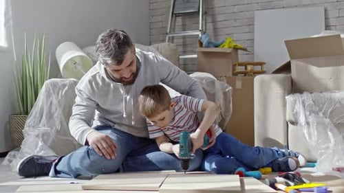 Father and Son Working on Home Improvement Project