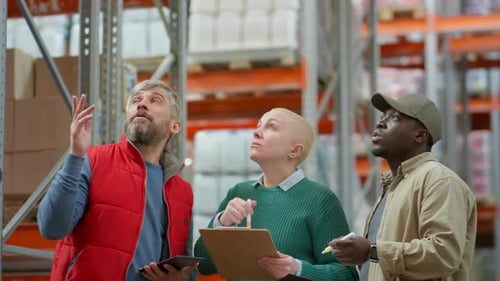 Multiethnic Team Working in Warehouse