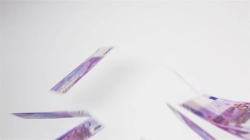 Euro Banknotes Fly in the Air and Landing on White Surface