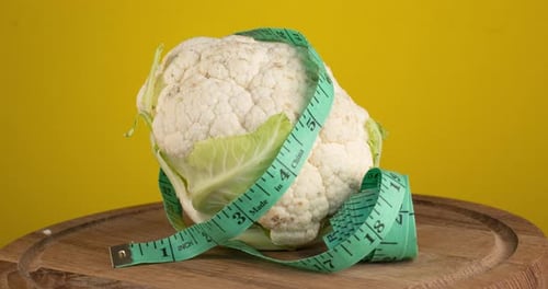 Fresh Cauliflower Head with Measuring Tape