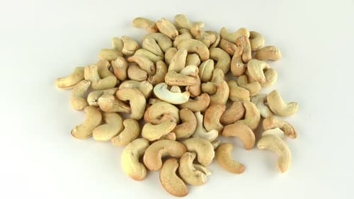 Pile of Cashew Nuts on White Surface