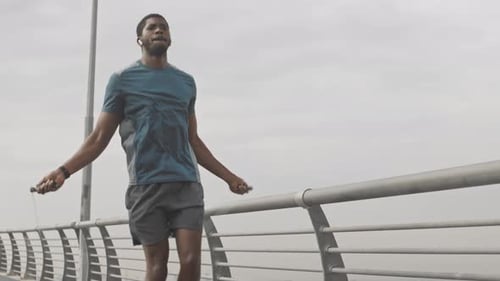 Man Jumps Rope for Exercise Outdoors