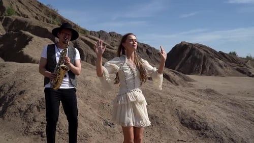 Woman Sings as Saxophone Player Performs Outdoors