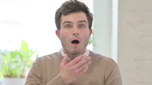 Man Reacts with Shock Indoors Close Up