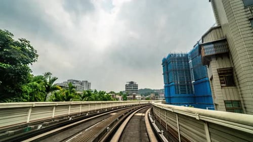 Timelapse Front View of City Street From MRT Fully Automated Driverless Train Through Windscreen